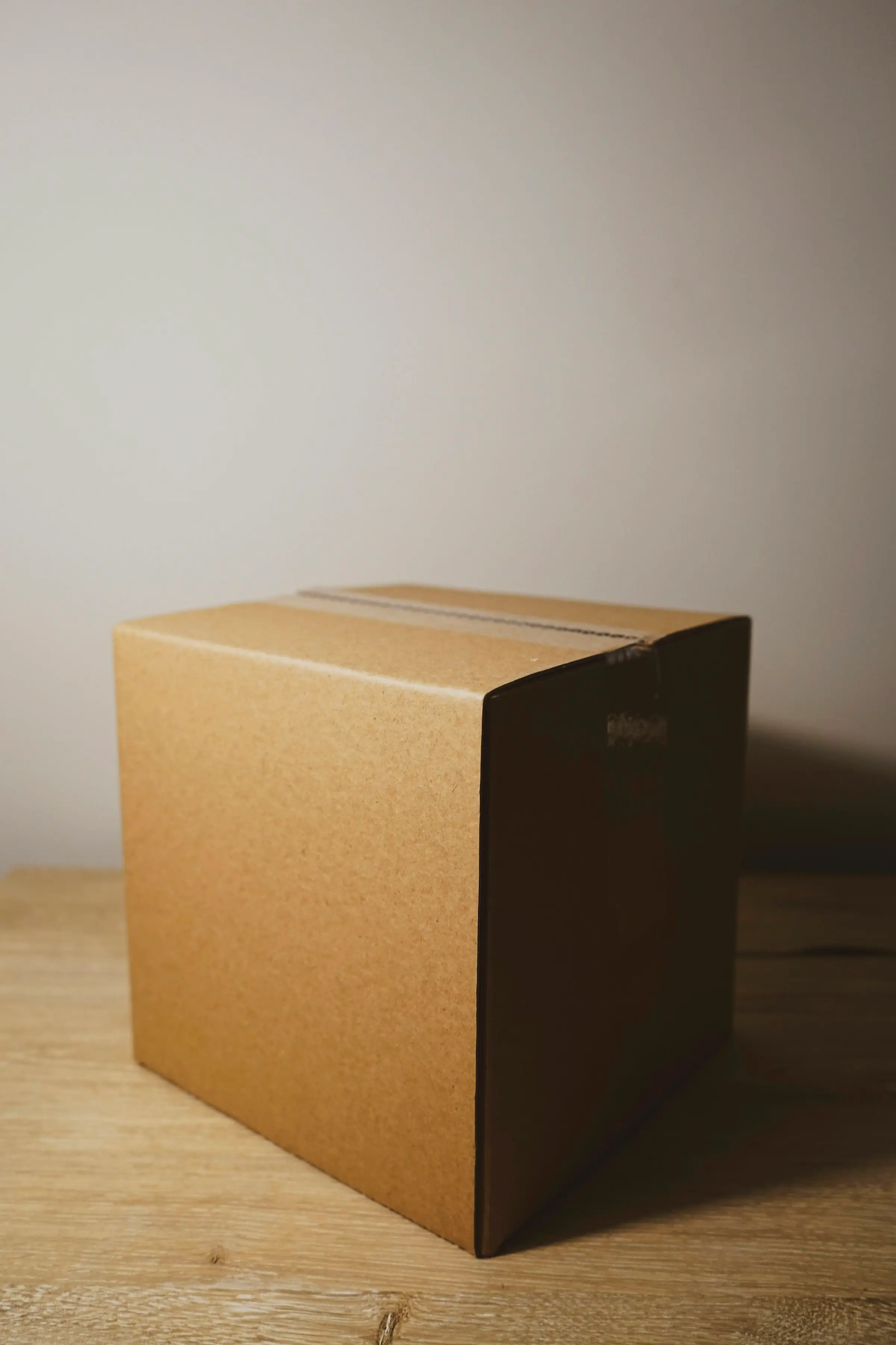 Printed cartons on a bench, folded and ready.