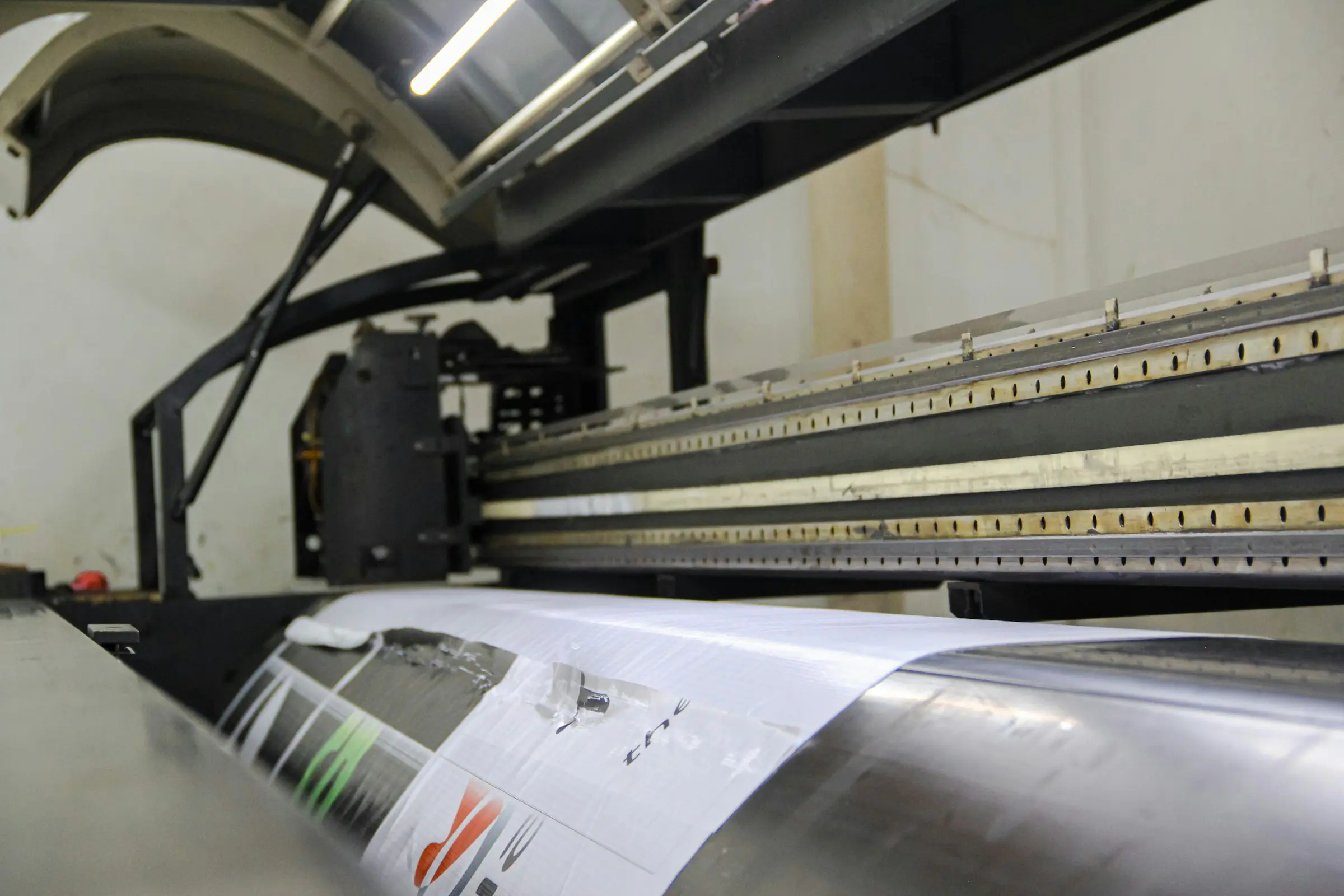 A press sheet pulled for checking, colour bar along the edge.