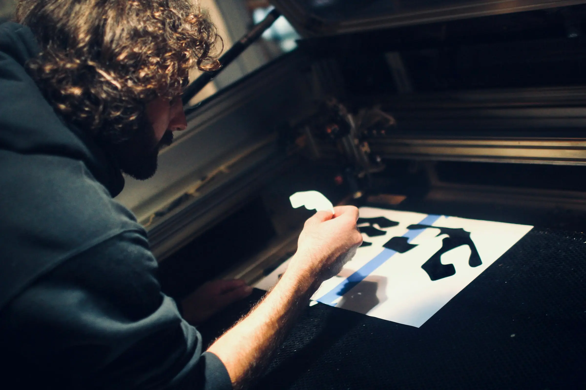 Cut vinyl being weeded on the bench.